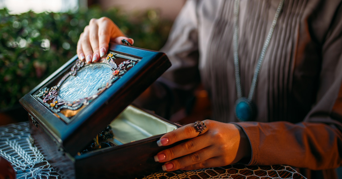 A woman looks through keepsakes to determine what to keep and what to donate.