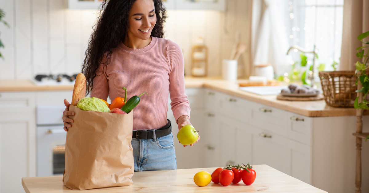 A woman unpacks groceries